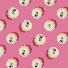 white pumpkins with spiders on pink background, halloween seamless pattern, template for designer, flat lay