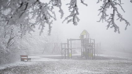 Playground in winter covered with snow