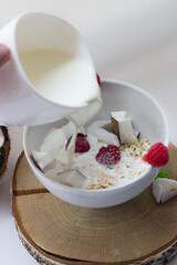 healthy Breakfast oatmeal porridge and fruit berries on a white background