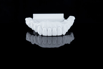 Milled raw zircon dental prosthesis for patient after milling machine, lower jaw.