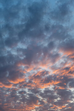 sunset sky with clouds vertical background. Clouds on a hot summer day.