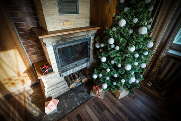 Interior of wooden chalet with christmas tree