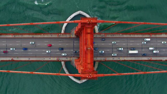 High aerial view of the Golden Gate Bridge. San Francisco, US. It connects the San Francisco peninsula to Marin County.  US route 101  and SR 1 full of traffic. Shot on Red weapon 8K.
