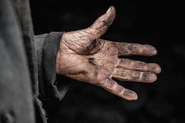 Close up dirty hand hard work of coal miner worker