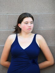 Female beauty expressions wearing a blue swimsuit.