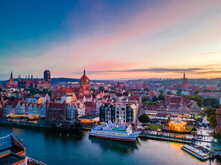 Fototapeta na wymiar Aerial sunset view of the amazing old town and rivers of Gdansk with ships