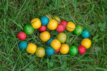 Colorfull wood beads on thread, fashionable beaded bracelets, bright beautiful colors green red yellow and light blue