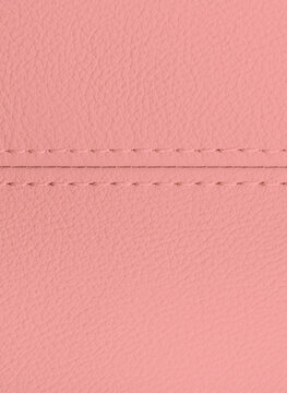 Leather texture background for design, light pink illustration. Texture, color, artificial leather with stitching © gargantiopa