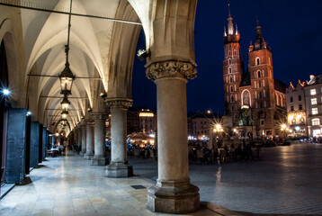 View of Mariacki church from Cloth Hall in Main Square, Cracow, Poland