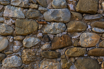 Texture of an old wall from different stones
