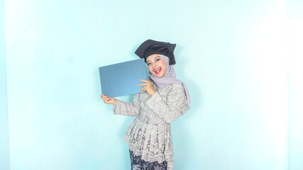 Beautiful asian muslim college graduate with degree