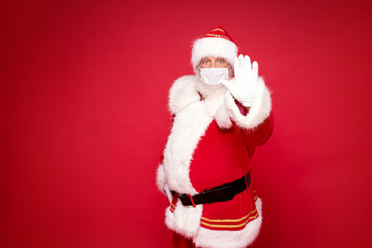 Real Santa Claus in white mask posing