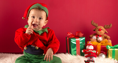Fototapeta na wymiar Adorable child, in Christmas decoration and elf dress
