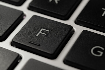 Close-up of an F Key of a Laptop Notebook Keyboard Letters Press