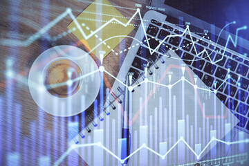Double exposure of forex chart drawing over table background with computer. Concept of financial research and analysis. Top view.