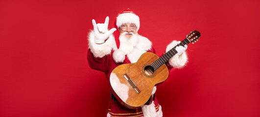 Santa Claus playing on guitar