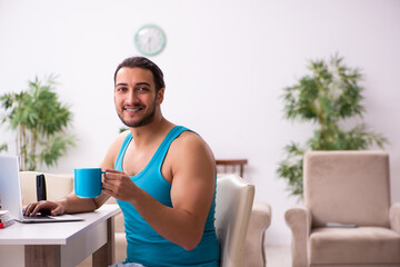 Young man working from house during pandemic