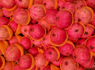 fresh red pomegranate on the stall for sale