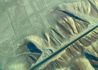 mysterious geometric drawings  geogliphs Lines Nasca in rocky sand desert Peru, South America, Pan american highway, airplane flight, 