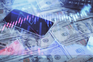 Naklejka premium Double exposure of forex graph drawing over us dollars bill background. Concept of financial markets.