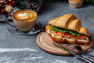 New Year's breakfast with croissants. New Year's croissant with red fish and avocado. New Year and Christmas concept