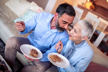 Romantic mature couple having birthday party.