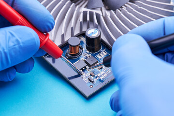 computer hardware support service concept. technician diagnosing and repairing pcb circuit board