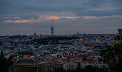 
panoramic view of Prague and roofs of Prague buildings at sunset in the Czech Republic