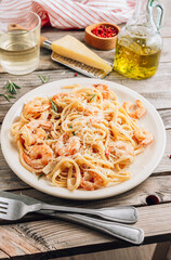 Pasta tagliatelle with shrimps in creamy sauce