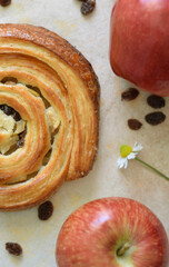 Freshly baked red apple and raisin roll for Sunday breakfast.