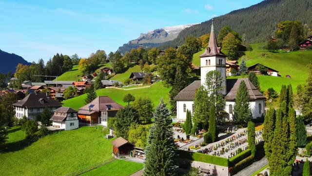 Famous city of Grindelwald in the Swiss Alps from above - drone footage