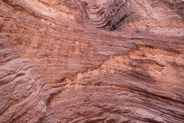 Geology. Natural texture and pattern. Closeup view of the red sandstone and rocky formation in the desert.