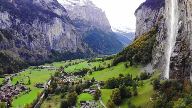Aerial view over the village of Lauterbrunnen in Switzerlandwith its famous waterfall - drone footage