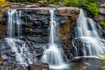 Fototapeta premium Blackwater Falls famous waterfall closeup in State Park in West Virginia during autumn fall season with long exposure of water