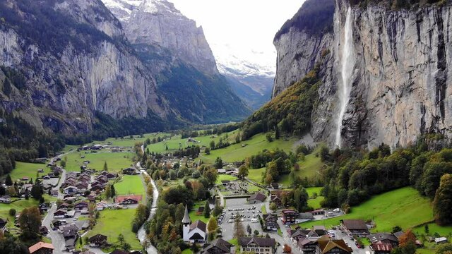 Aerial view over the village of Lauterbrunnen in Switzerlandwith its famous waterfall - drone footage