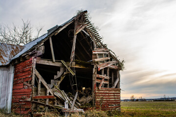 Old abandoned barn in a field
