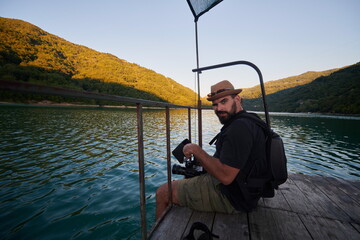 videographer taking action shot of triathlon swimming athlete