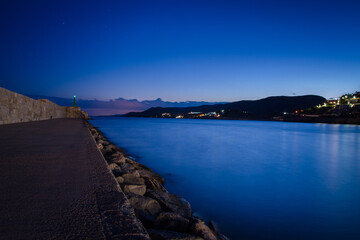 Breakwater at the entrance to the harbor of Peniscola at night, Castellon, Spain