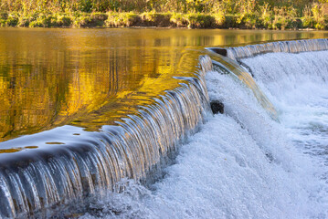 Old Mill dam at Humber River in Autumn, Toronto, Ontario, Canada