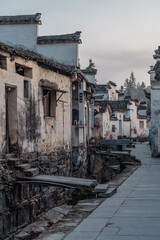 Fototapeta na wymiar Sunrise view of the streets and architectures in Xidi village, an ancient Chinese village in Anhui Province, China, a UNESCO world cultural heritage site.
