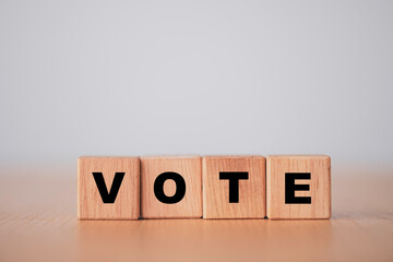 Vote and election concept, Vote wording print screen on wooden cubes block.