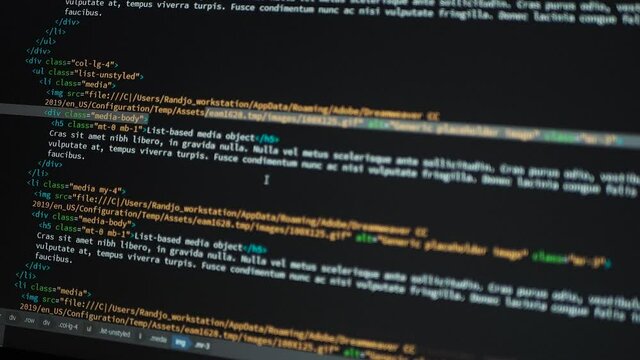 Developer is browsing html code on the computer screen. HTML Web Page Code Scrolling Programming code abstract technology background for software developer and Computer script concept.Scene D.