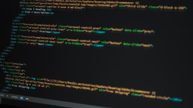 Developer is browsing html code on the computer screen. HTML Web Page Code Scrolling Programming code abstract technology background for software developer and Computer script concept.Scene C.