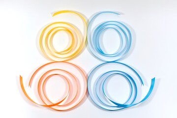 Butterfly from satin twisted ribbons of braid. Four wings on a light background.