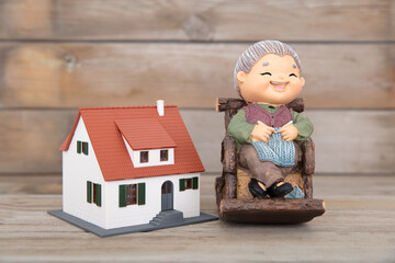 Granny statue and a house model