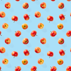 Seamless pattern with ripe apples. Tropical fruit abstract background. Apple seamless pattern on blue background.
