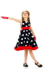 Full Length Portrait of Pretty Girl in Polka Dot Dress