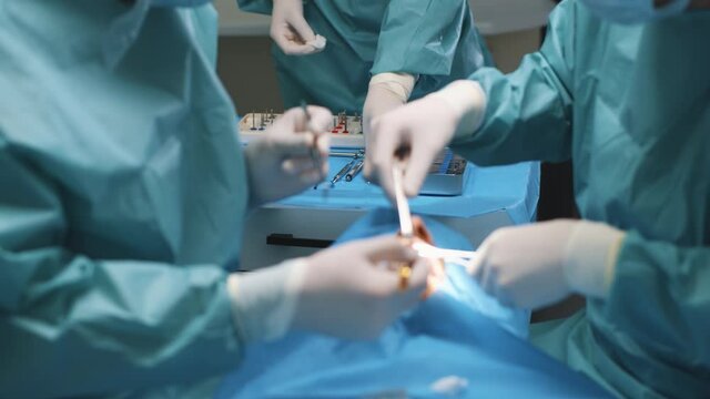 Dental clinic. Teamwork. Tooth doctor and orthodontist surgeon doing medical surgery operation on root canals. Stomatology office. Professional tools. Dentistry.