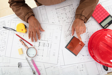 Architects compare house models to view drawings