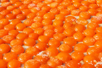 Orange duck egg yolks in winnow basket, Tai O village, Hong Kong